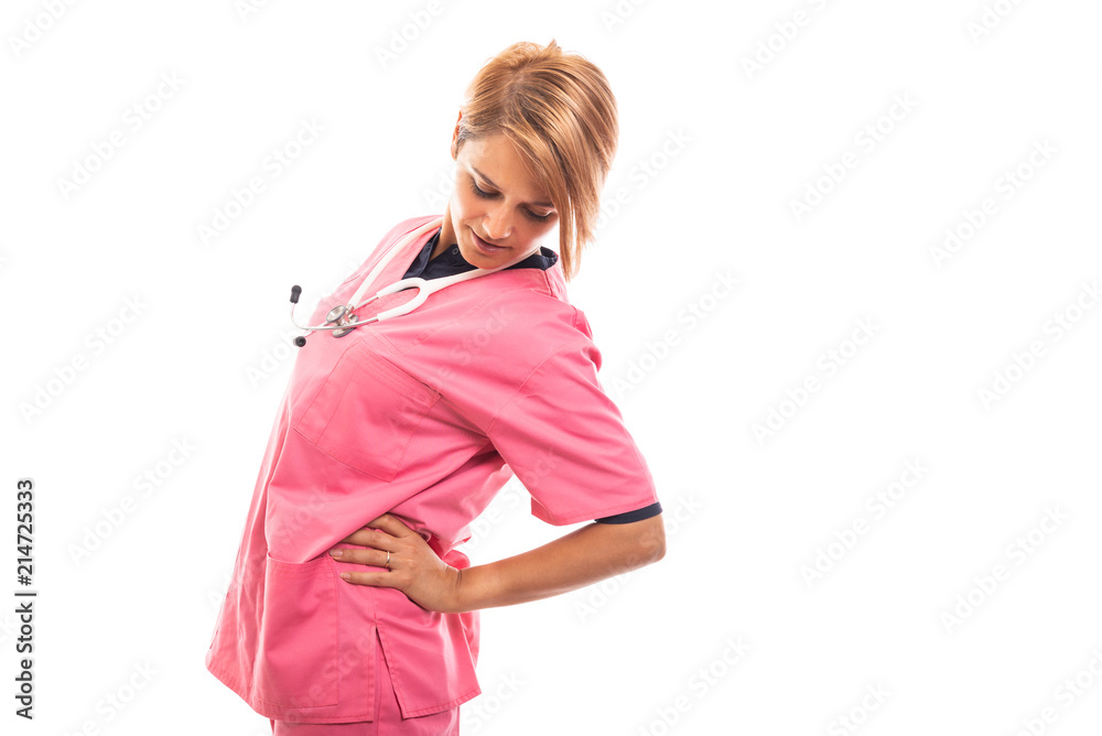 Female vet wearing pink scrub showing back pain gesture. Female vet wearing pink scrub showing back pain gesture.