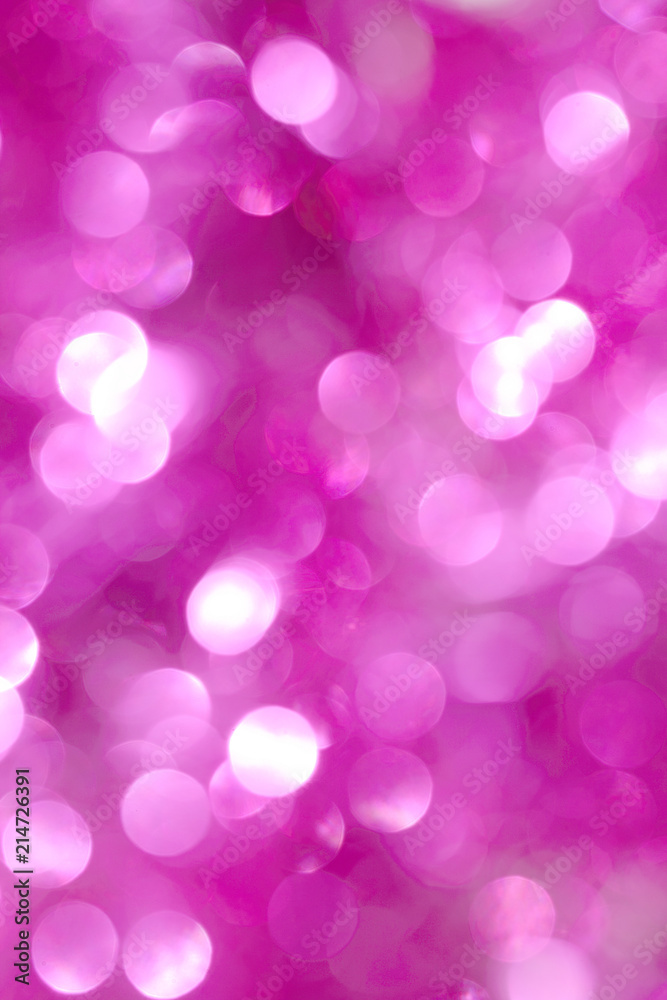 A shiny pink New Year's background for a holiday card. A wallpaper with a blurry pattern.