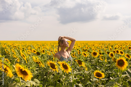 model in sunflower field