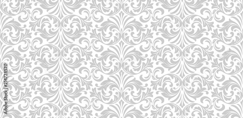 Wallpaper in the style of Baroque. Seamless vector background. White and grey floral ornament. Graphic pattern for fabric, wallpaper, packaging. Ornate Damask flower ornament.