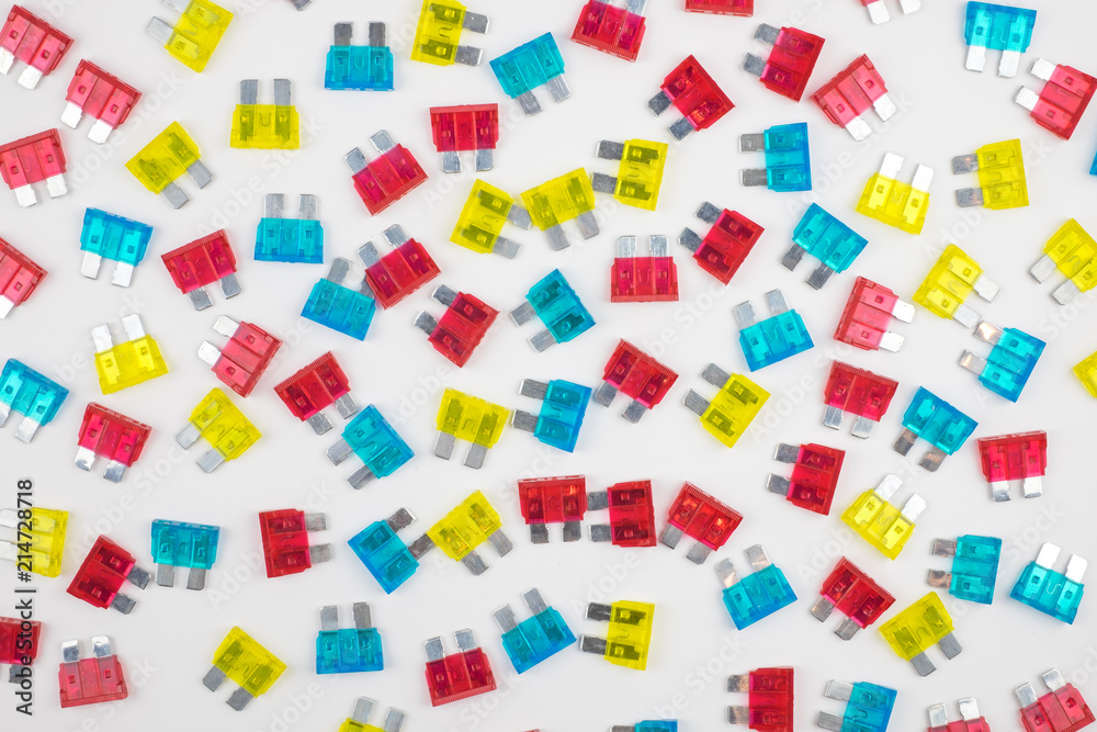 Compose of many colorful electrical automotive car fuse red, blue,yellow colors on white background. Compose of many colorful electrical automotive car fuse red, blue,yellow colors on white background.