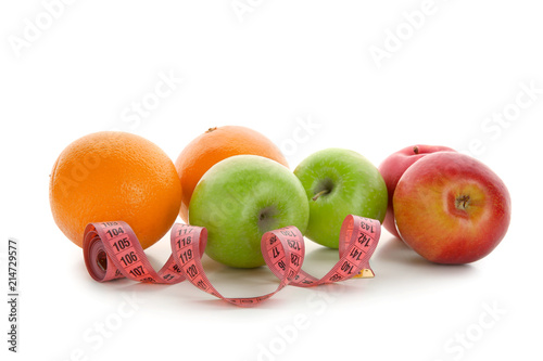 Fruits and measuring tape on white background. Diet food