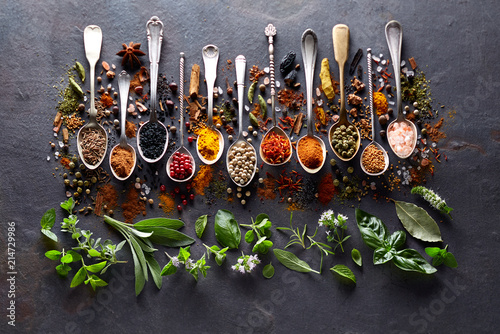 Fototapeta Naklejka Na Ścianę i Meble -  Herbs and spices on black board