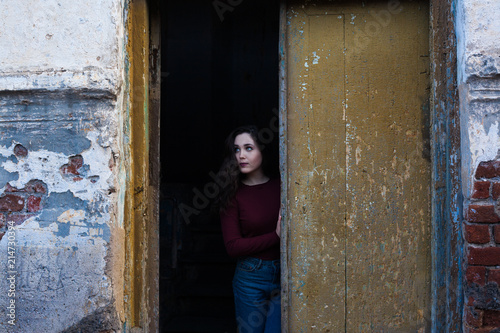 dark-haired girl on a gloomy background © Евгений Округин