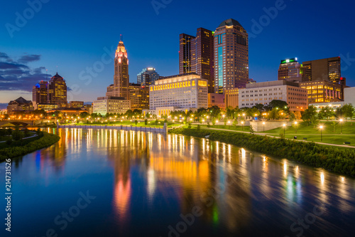 The Scioto River and Columbus skyline at night, in Columbus, Ohio. © jonbilous