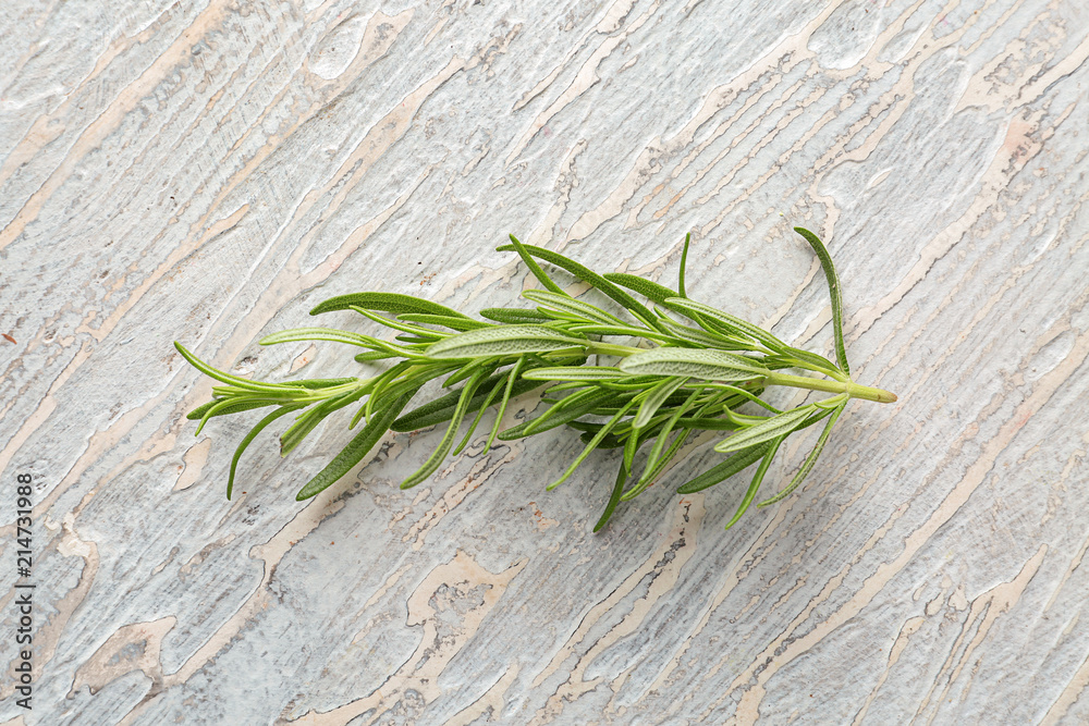 Fresh rosemary on light textured background Fresh rosemary on light textured background