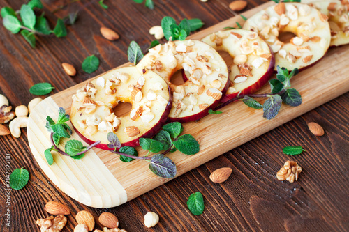 Healthy snacks sliced apples with honey and nuts