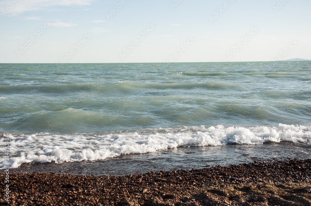 Beautiful sea waves hitting the pebble beach. Beautiful sea waves hitting the pebble beach.