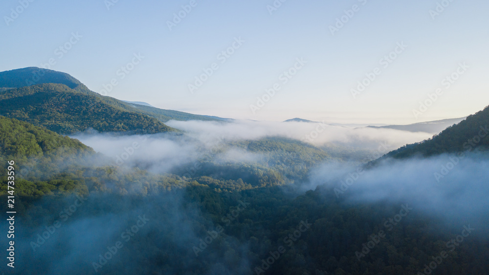 Epic Aerial Flight Through Mountain Clouds. Sunrise Beautiful Morning.