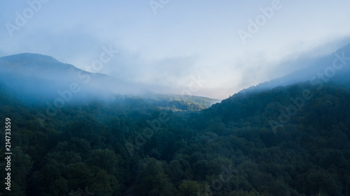 Epic Aerial Flight Through Mountain Clouds. Sunrise Beautiful Morning.