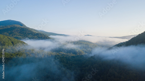 Epic Aerial Flight Through Mountain Clouds. Sunrise Beautiful Morning.
