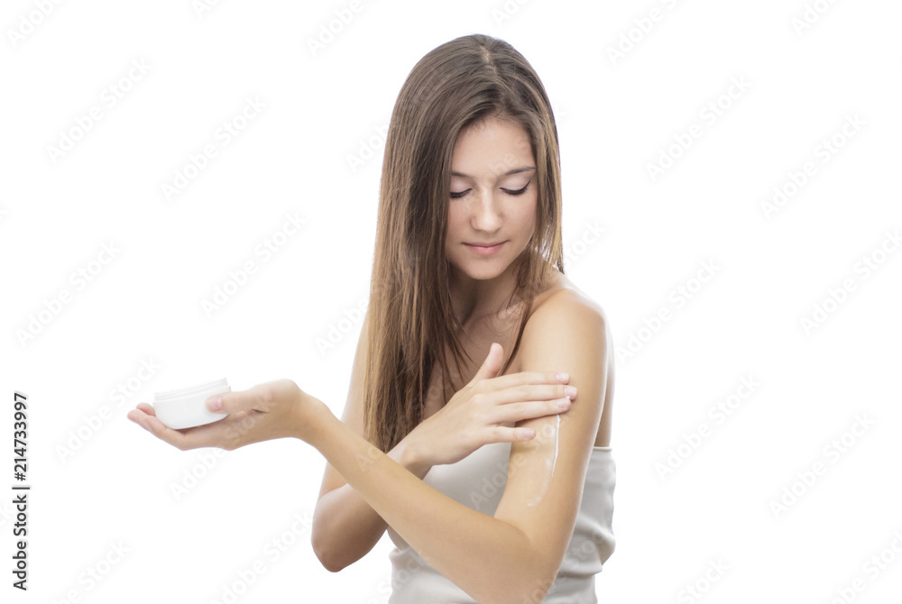 beautiful girl applying body lotion on her body beautiful girl applying body lotion on her body