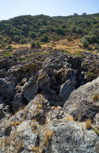 The eroded schists form sharp blades and deep drops in the rocks. Pulo do Lobo. Alentejo, Portugal.