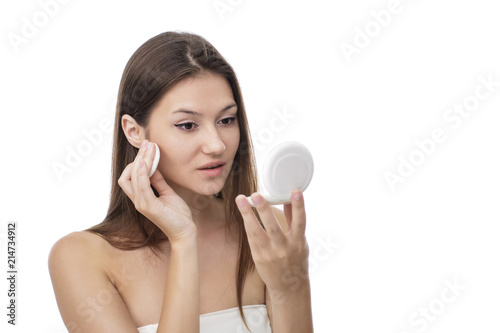 beautiful girl applying face powder