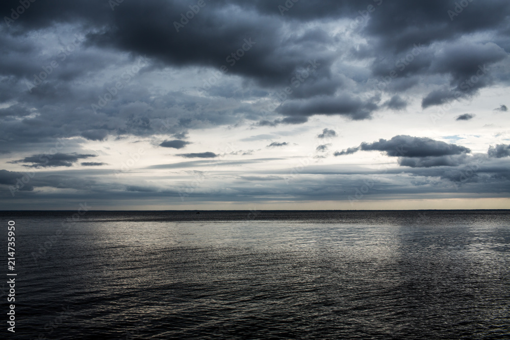 sea landscape, gloomy sky and calm sea