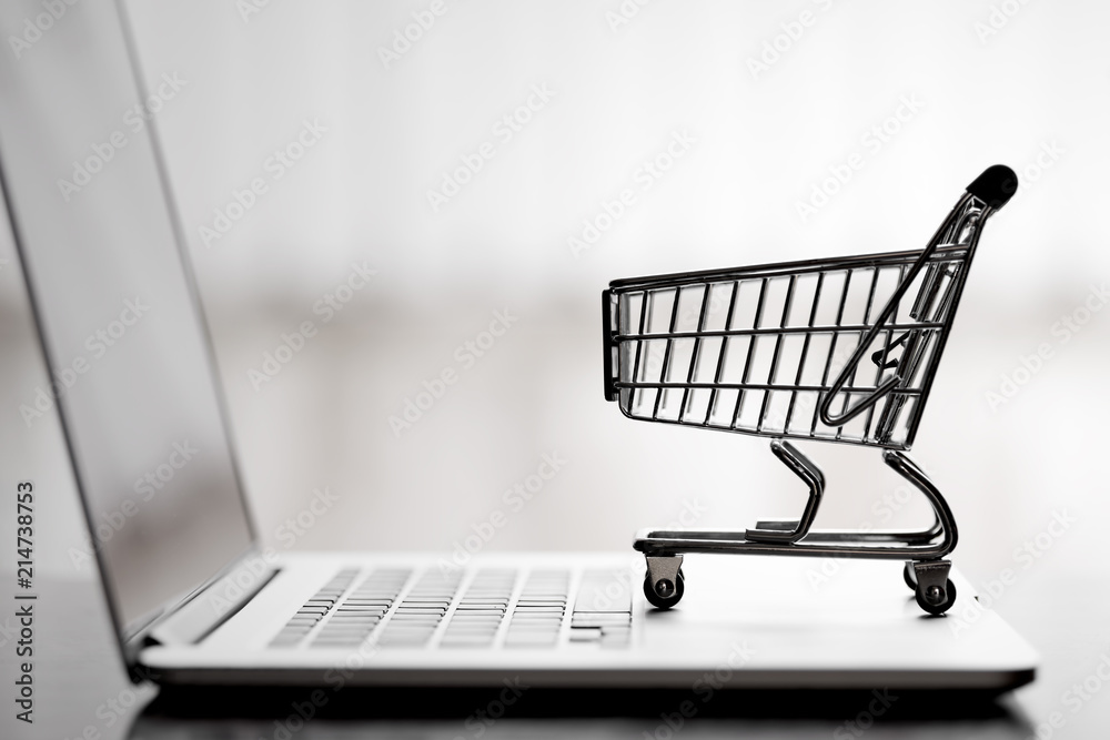 Shopping cart on laptop,online shopping and delivery service concept.