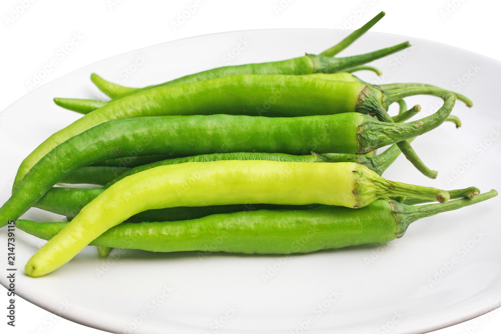 Fresh big green chilli in plate isolated on white background Fresh big green chilli in plate isolated on white background