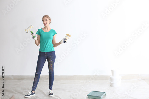 Professional painter with tools indoors