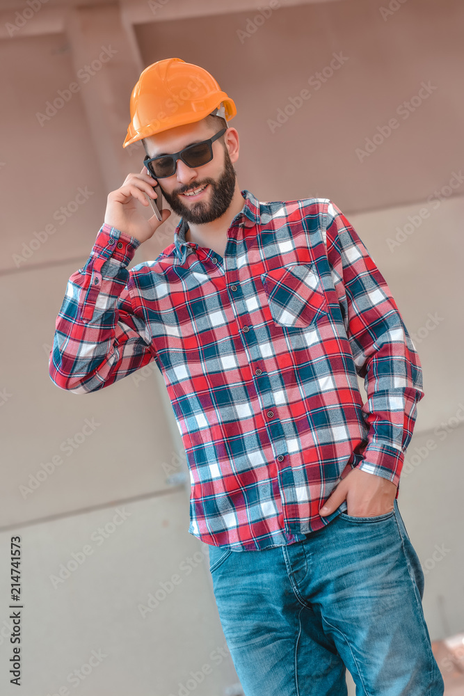 Portrait of an architect at work in a construction site Portrait of an architect at work in a construction site