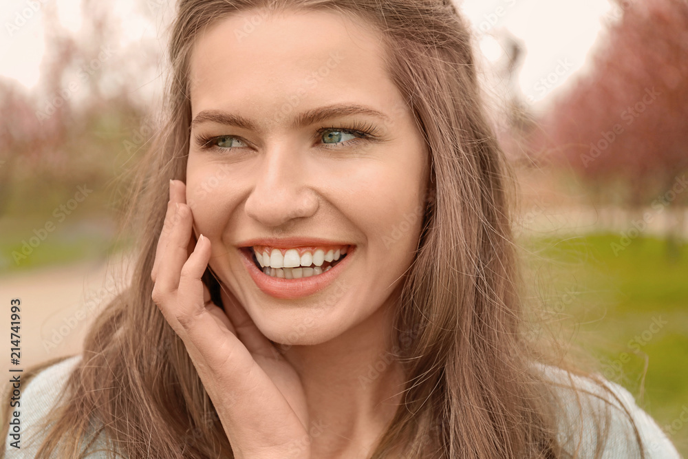 Beautiful young woman in park on spring day Beautiful young woman in park on spring day