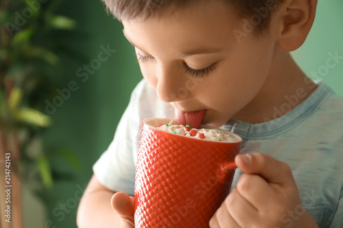 Cute little boy with cup of...