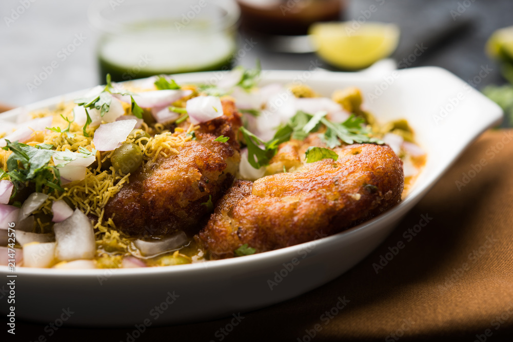 Ragda Pattice is a popular Street food or chat made of potato Patties. served in a steel plate, bowl or ceramic plate with tamarind and cilantro chutney