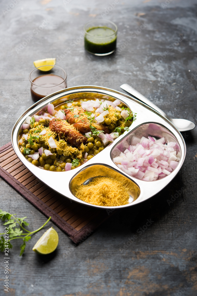 Ragda Pattice is a popular Street food or chat made of potato Patties. served in a steel plate, bowl or ceramic plate with tamarind and cilantro chutney Ragda Pattice is a popular Street food or chat made of potato Patties. served in a steel plate, bowl or ceramic plate with tamarind and cilantro chutney