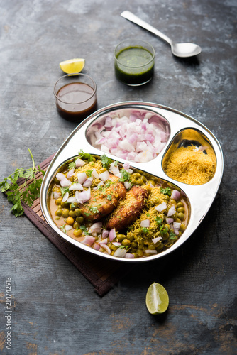 Ragda Pattice is a popular Street food or chat made of potato Patties. served in a steel plate, bowl or ceramic plate with tamarind and cilantro chutney