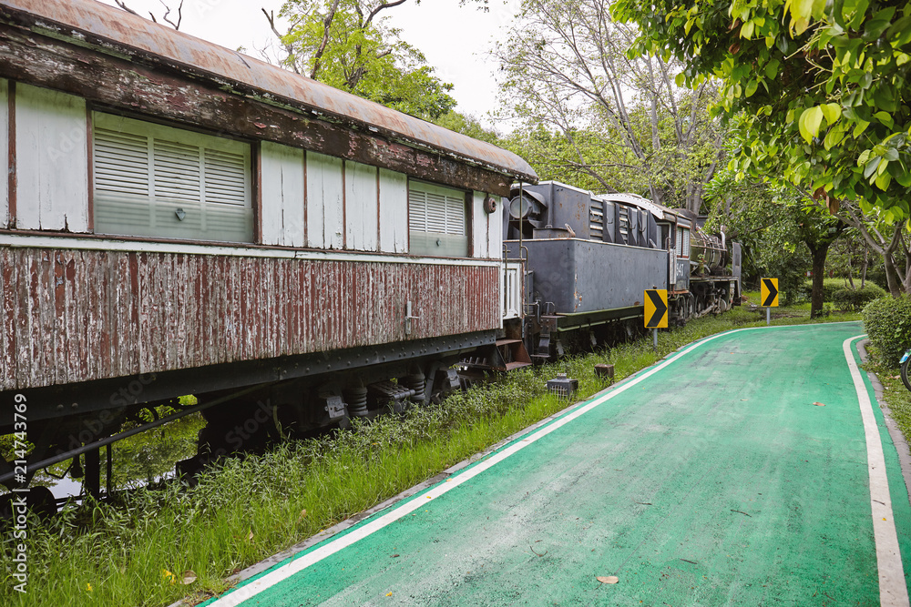 BANGKOK, THAILAND - APRIL 7, 2018: Abandoned old train in the city park BANGKOK, THAILAND - APRIL 7, 2018: Abandoned old train in the city park