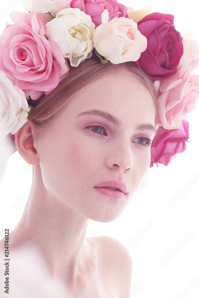 Portrait of a beautiful blonde woman with flowers in her hair. Portrait of a beautiful blonde woman with flowers in her hair.