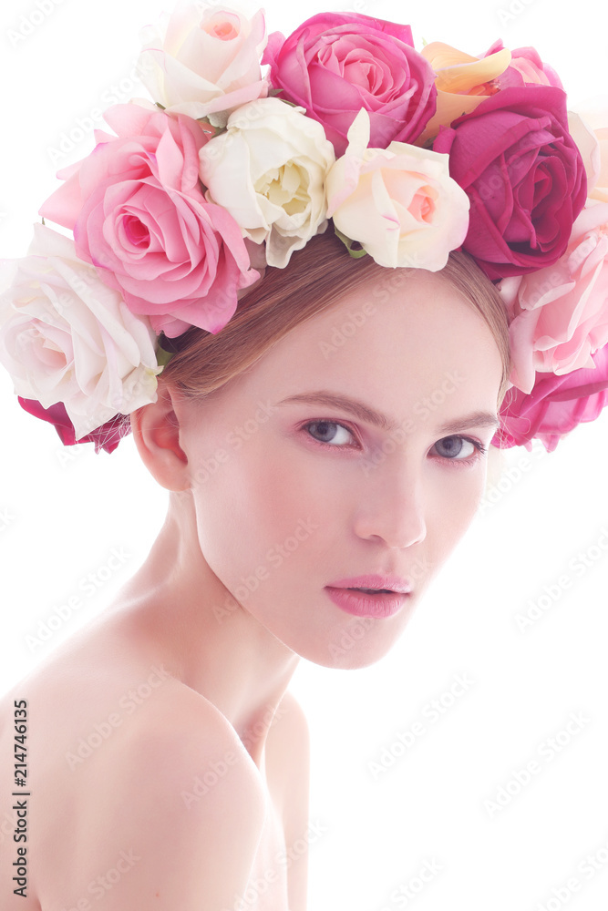 Portrait of a beautiful blonde woman with flowers in her hair.