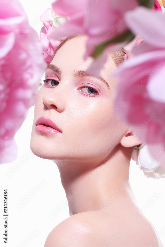 Portrait of a beautiful blonde woman with flowers in her hair. Portrait of a beautiful blonde woman with flowers in her hair.