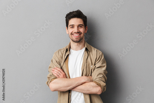 Portrait of a happy young casual man standing photo