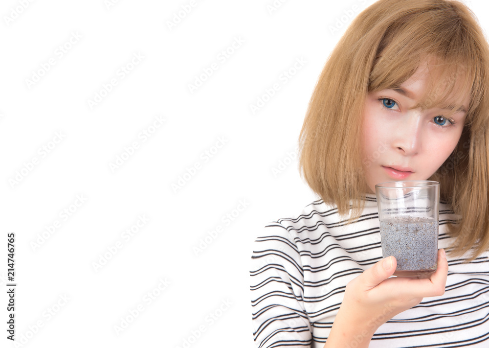 Close up asian woman holding glass of chia seeds soaking in water isolated on white background. Free from copy space. Weight loss concept. Close up asian woman holding glass of chia seeds soaking in water isolated on white background. Free from copy space. Weight loss concept.
