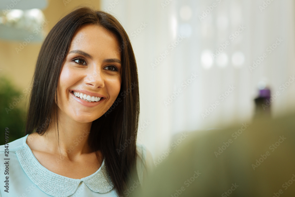 Beautiful smile. Portrait of a young smiling woman while looking at her mother