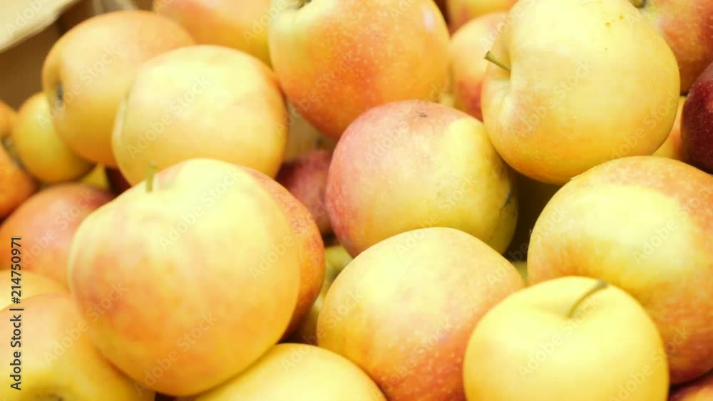 Apples close-up lie on the storefront in the supermarket. Apples close-up lie on the storefront in the supermarket.