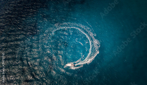Aerial view of speed boat in circle motion