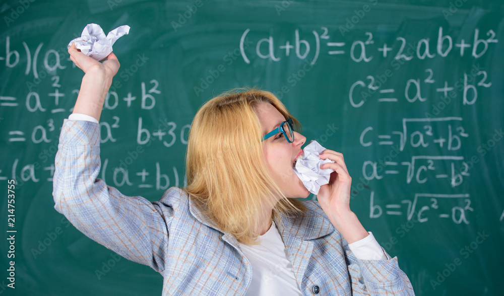 Teacher eats piece of paper absorb information. Teacher ready to eat her paperwork. Woman teacher eats crumpled piece of paper chalkboard background. Thirst of knowledge. Hungry for knowledge