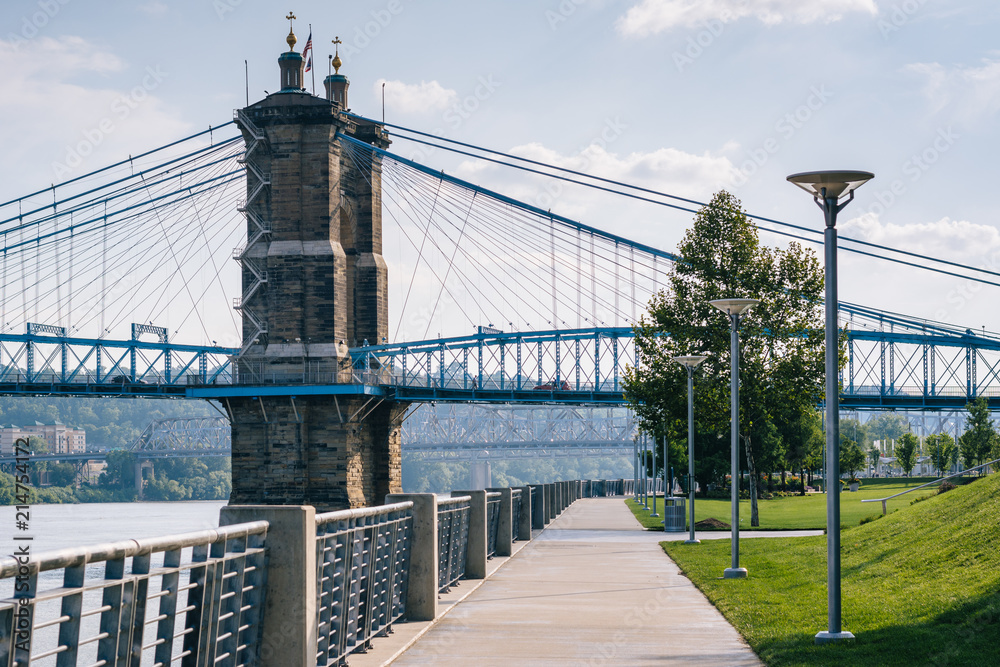 Walkway and the John A. Roebling Suspension Bridge, seen at Smale Riverfront Park, in Cincinnati, Ohio. Walkway and the John A. Roebling Suspension Bridge, seen at Smale Riverfront Park, in Cincinnati, Ohio.