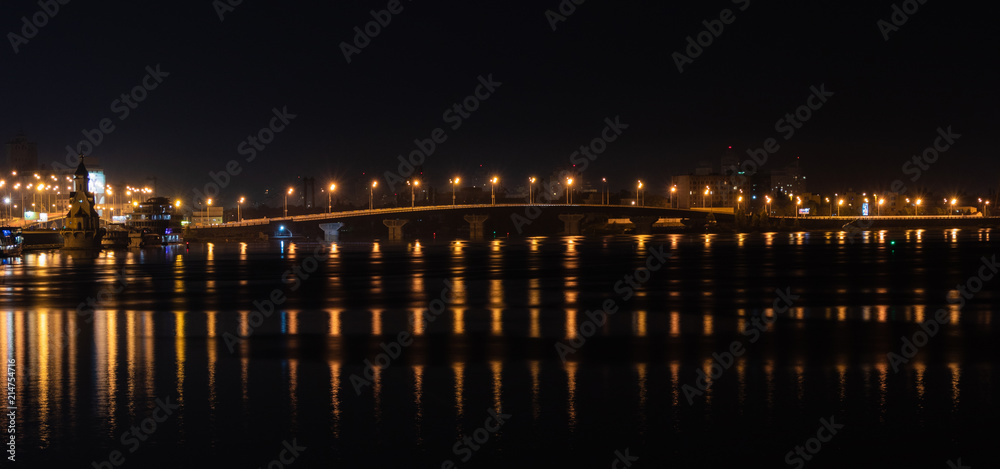 background. bridge with lights of street lamps. reflection of lanterns in a river