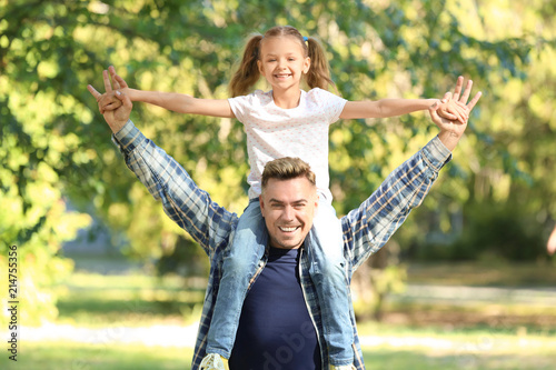 Portrait of happy father an...