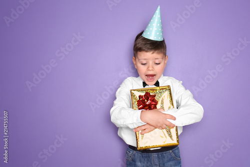 Cute little boy with gift f...