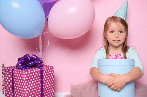 Cute little girl with gift ...