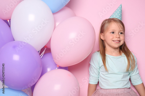Cute little girl with ballo...