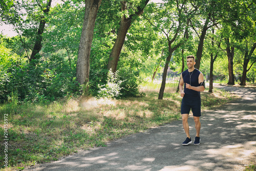 Sporty man running in park
