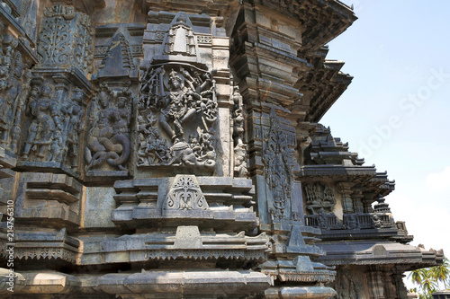 Ornate wall panel reliefs depicting, from left, Sundari, Nagas, Shiva as Gajasurasamhara, Bramha and Narayana on the extre right. Chennakesava temple, Belur, Karnataka. View from West.