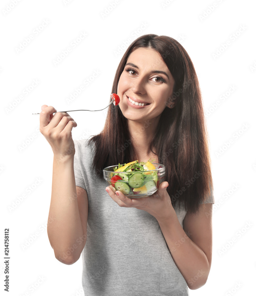 Woman with healthy vegetable salad on white background