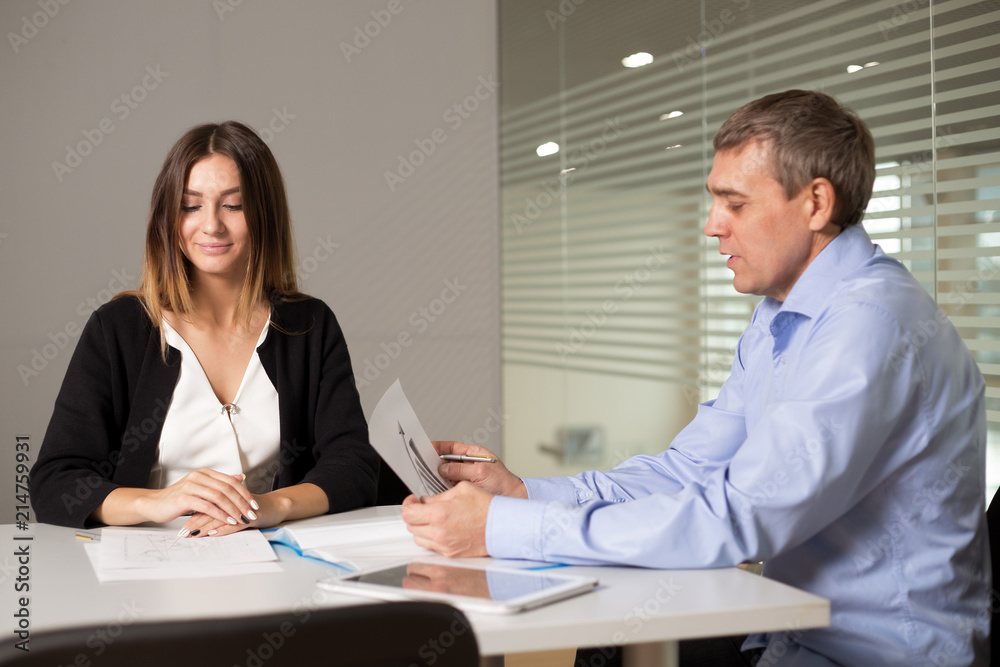 a man and a woman work in an office and talking a man and a woman work in an office and talking