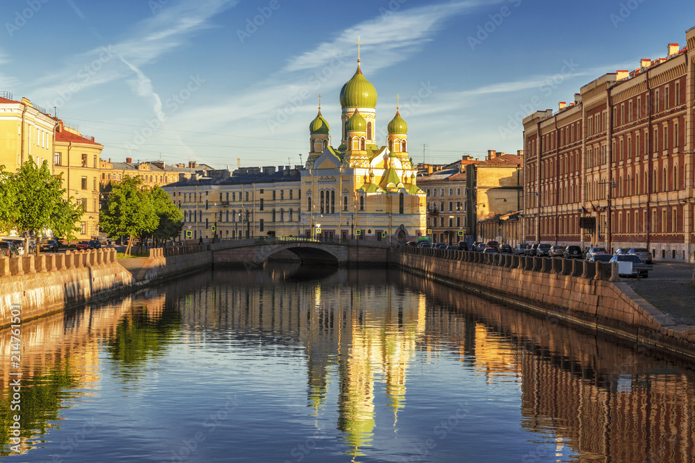 Fontanka river embankment in the early morning with St. Isidore Church, St. Petersburg, Russia