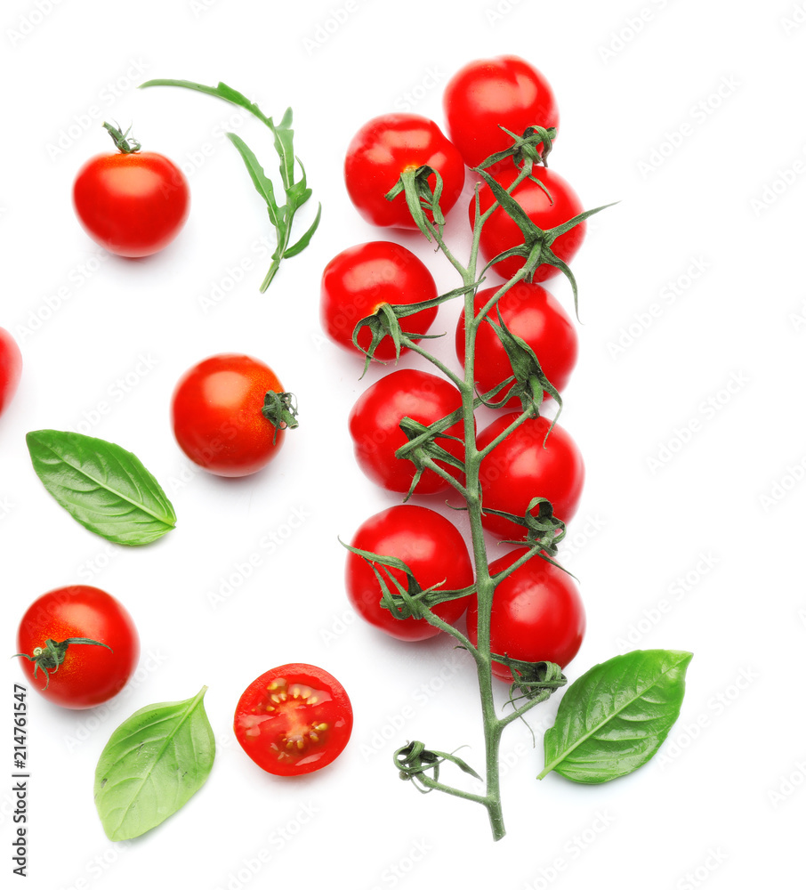 Fresh cherry tomatoes with basil on white background Fresh cherry tomatoes with basil on white background